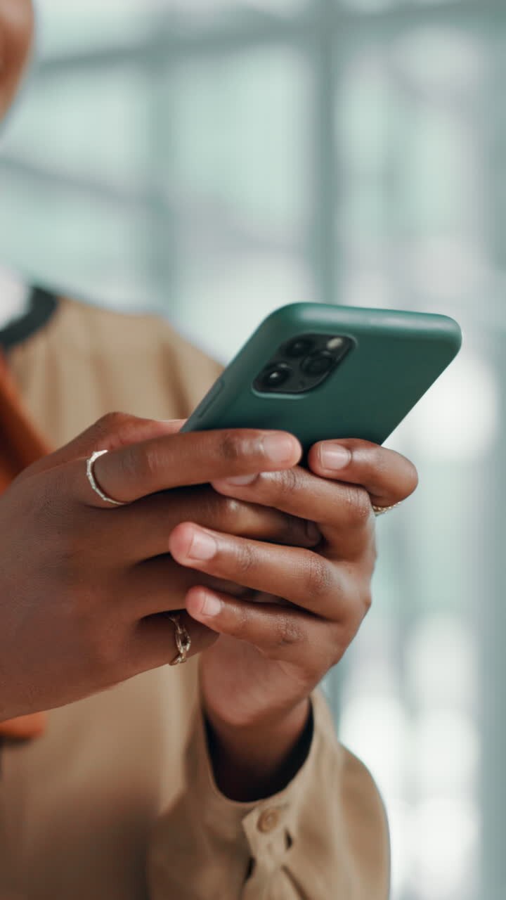 Close-Up of Person's Hands Using a Smartphone
