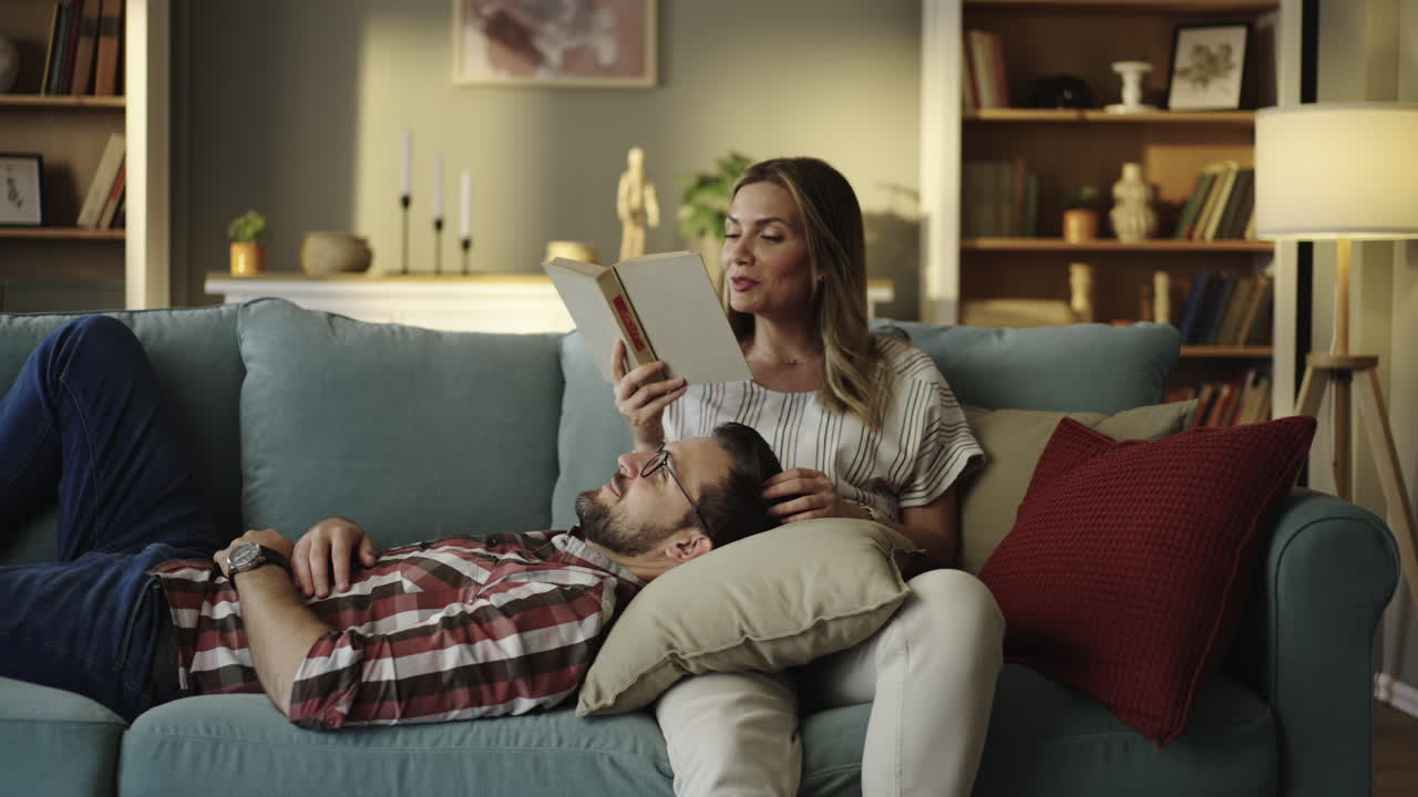Couple relaxing and reading at home