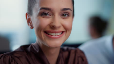 young businesswoman laughing at camera