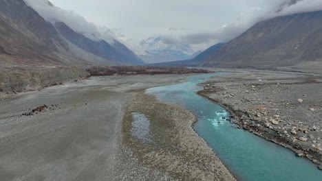 aerial view of hunza river flowing through nomal valley landscape in gilgit