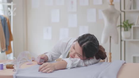 tired fashion designer taking a nap