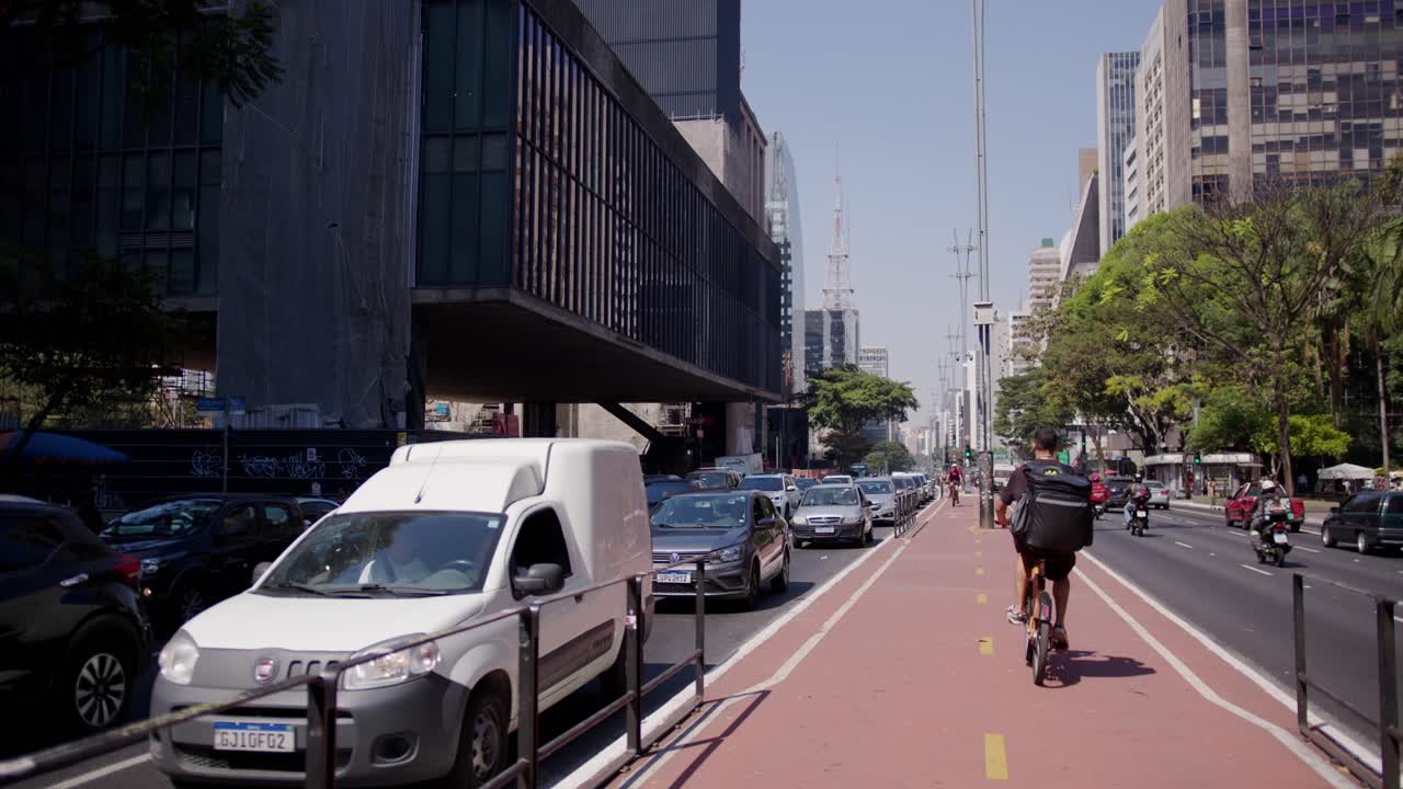 Delivery bag strapped tight and high, through the traffic, it will fly