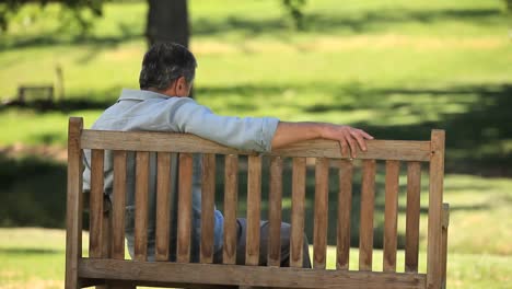 Old-man-relaxing-on-a-bench