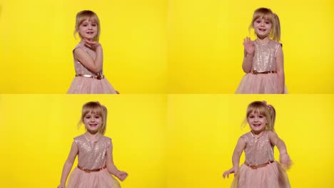 Friendly-little-blonde-child-kid-girl-waving-to-the-camera-doing-hello-or-bye-gesture,-slow-motion