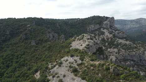 aerial drone view of a mountain ridge with mediterranean scrubland in herault