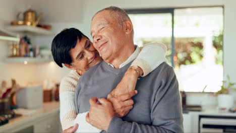 Senior-couple,-love-and-hug-in-house