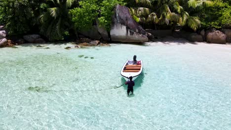 Seychelles-La-Digue-Row-Boat-and-Beach-Rocks-Aerial-Drone1