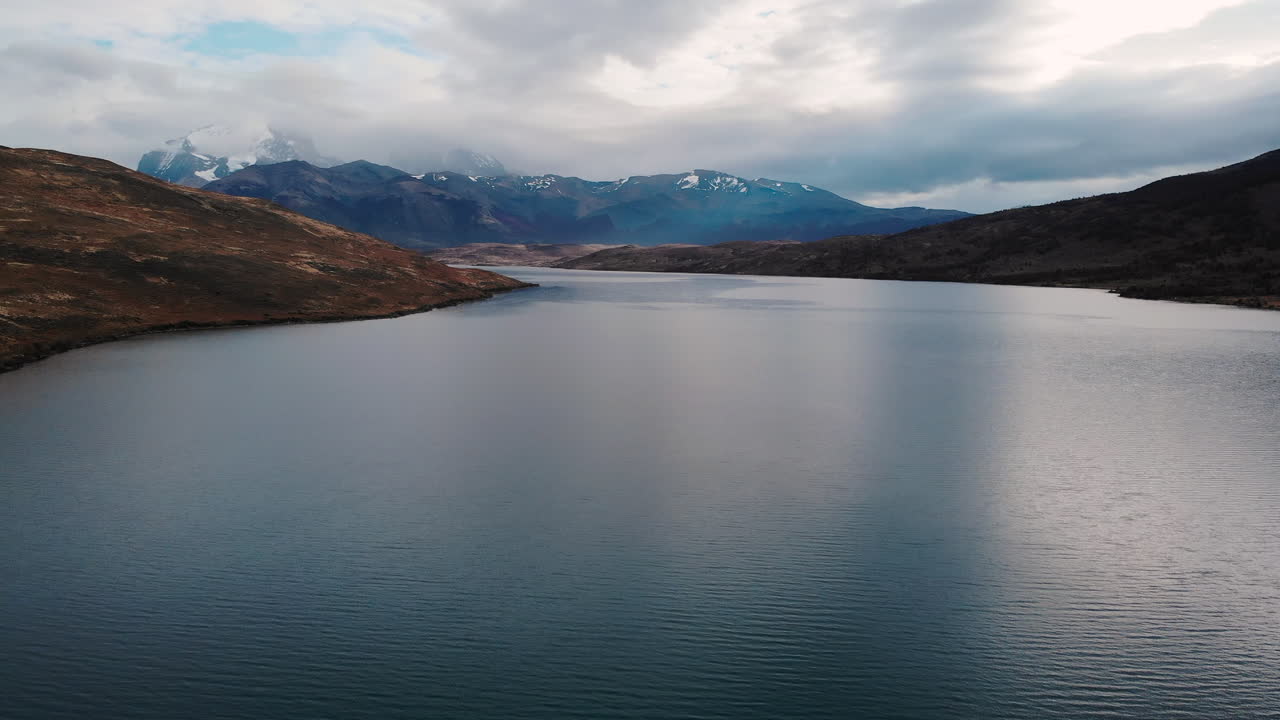 Scenic Lake Landscape with Mountains and Clouds