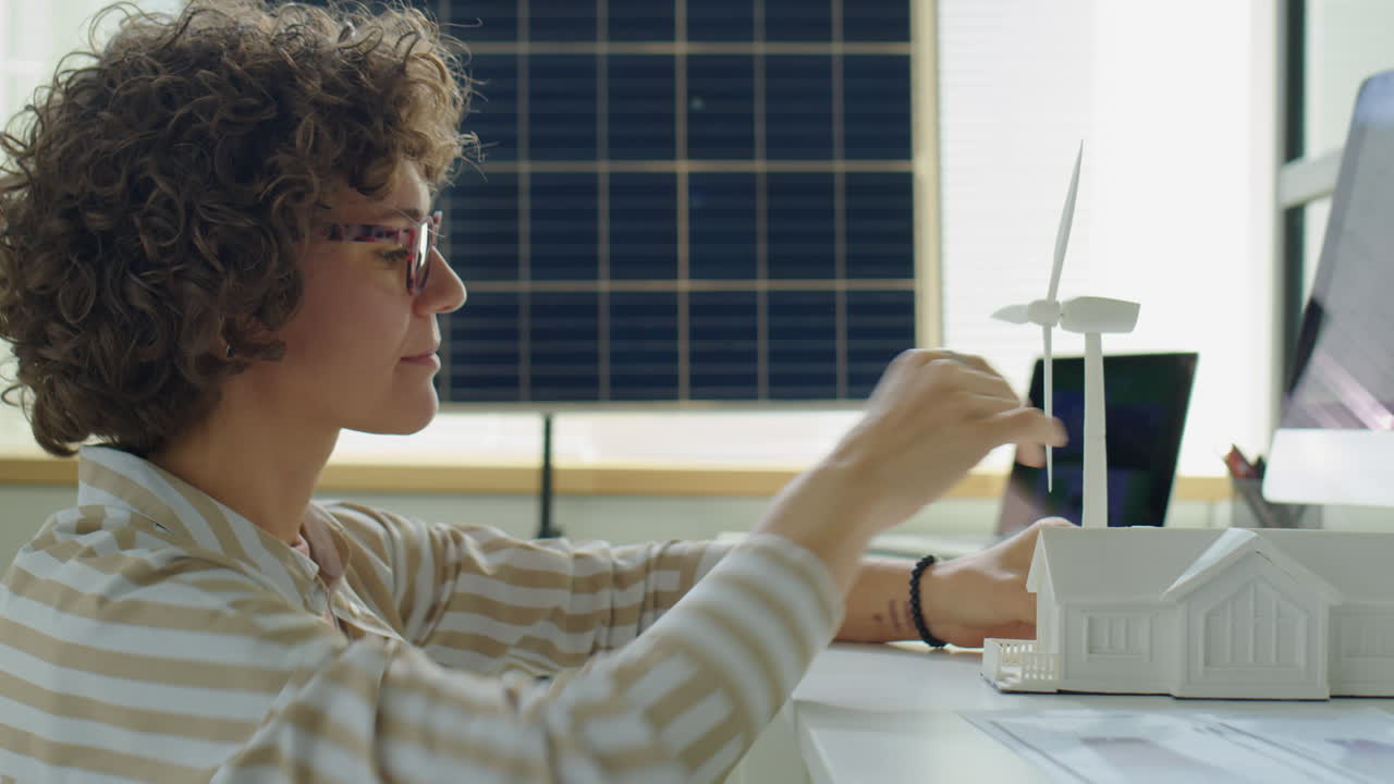 Female Renewable Energy Developer Working on Project