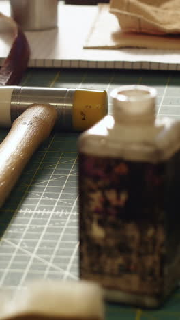 craftswoman preparing leather belt