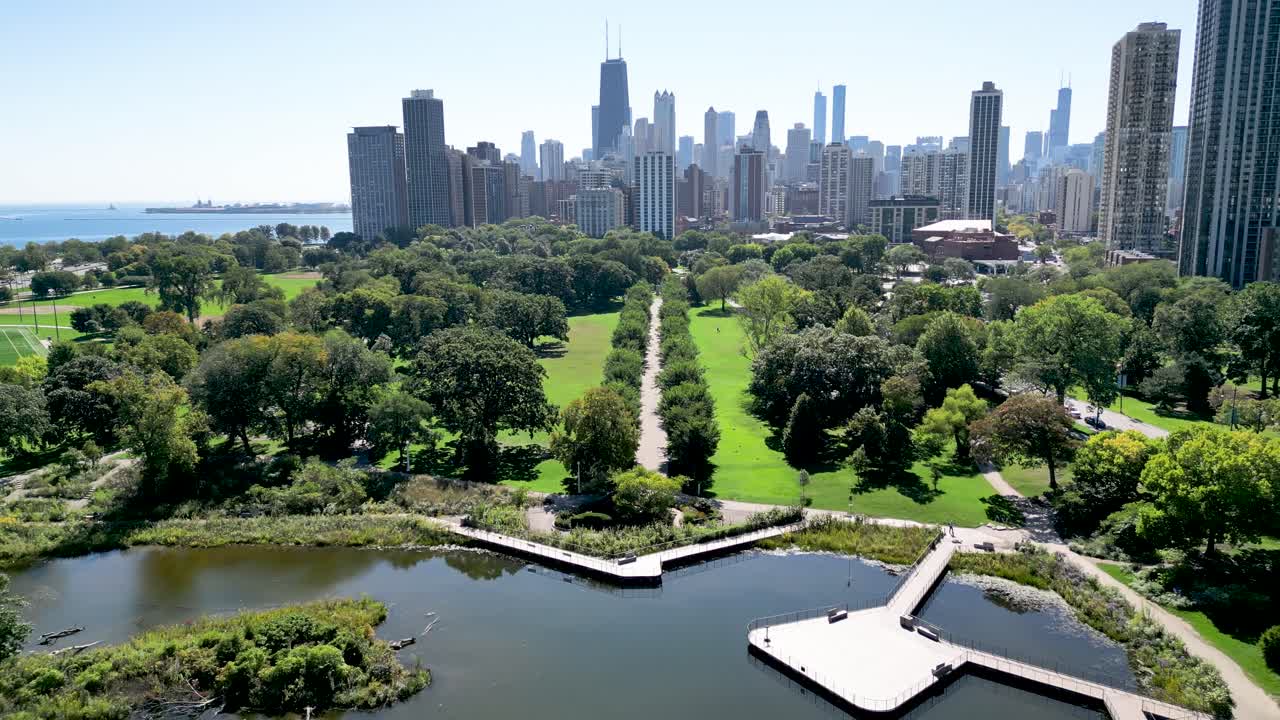 High resolution beautiful panoramic aerial drone 4K video of Lincoln Zoo Chicago and Chicago's skyline and its surrounding area