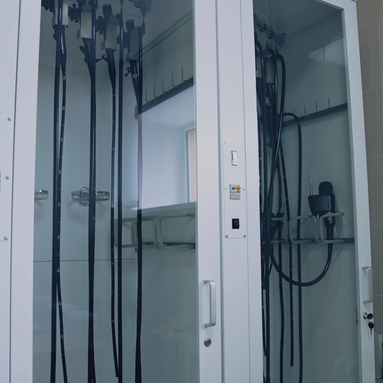 Glass wardrobe with medical tools in clinic. Surgical instruments in the operating room. Medical equipment
