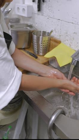 food service worker washing hands