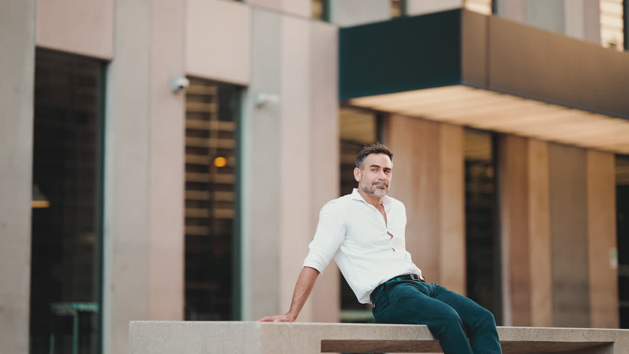 Man sitting in front of a building