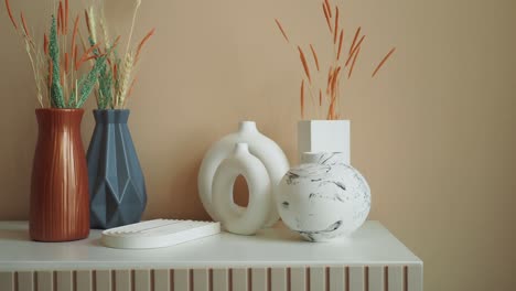 modern home decor with vases and dried flowers