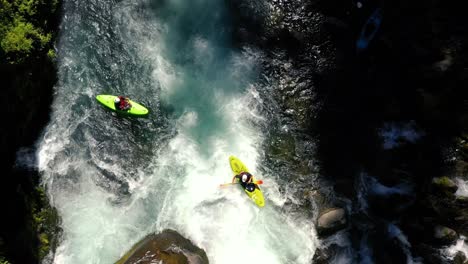 aerial view of whitewater kayaker running class iv rapids on the mill creek section of the rogue river in southern oregon