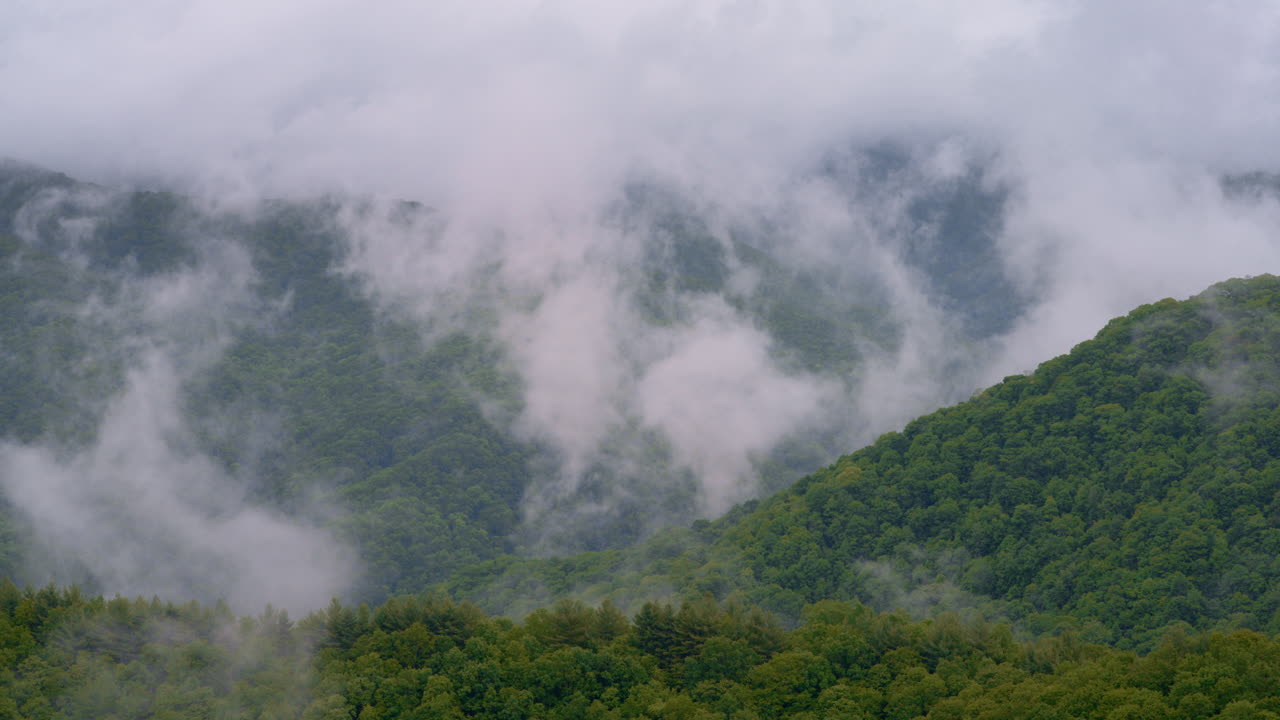 Smoky Mountains fade into thick mist in this cinematic clip
