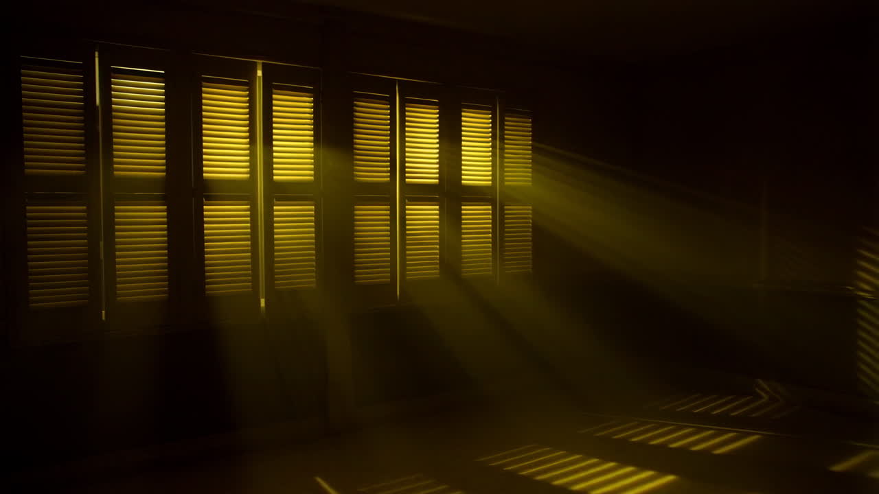 Sunlight Streaming Through Window Blinds in a Dark Room