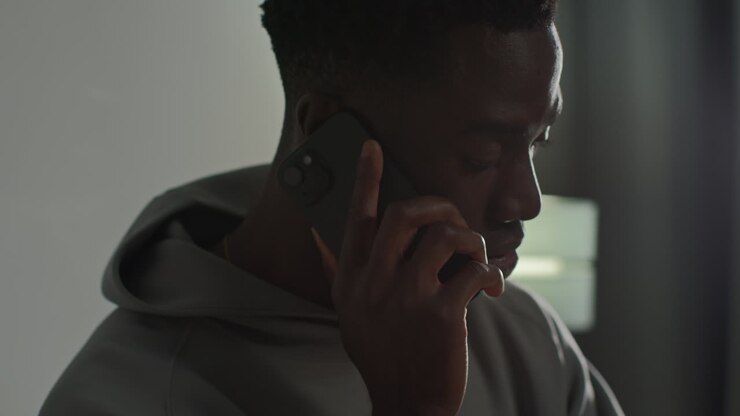 Close Up Of Young Man At Home Talking On Mobile Phone Reacting And Looking Upset After Getting Bad News 1