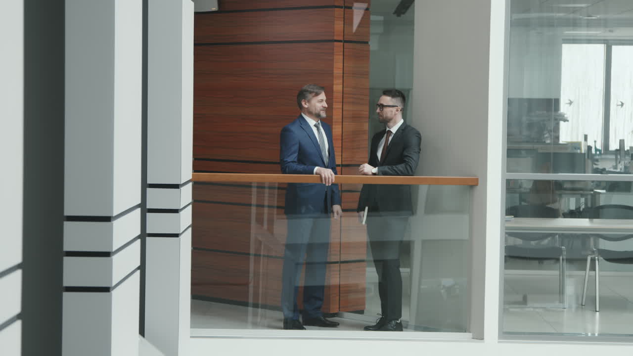 Business Men in Suits Talking in Office