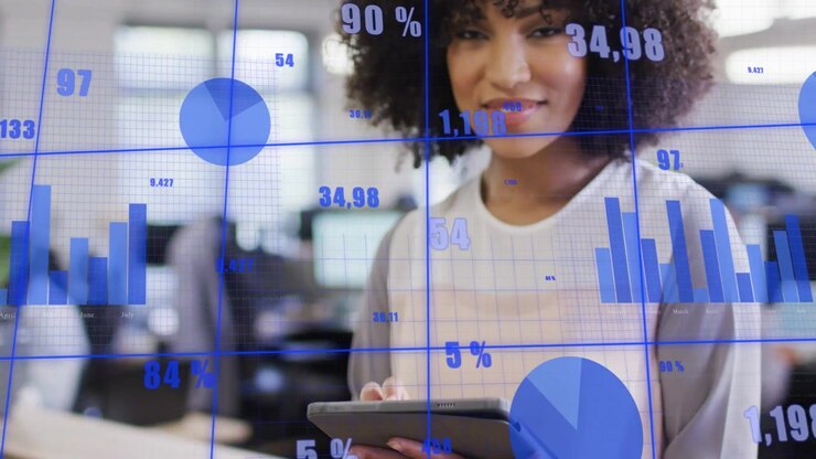 Vertical video: Female analyst tapping tablet in office, activating blue charts for business review