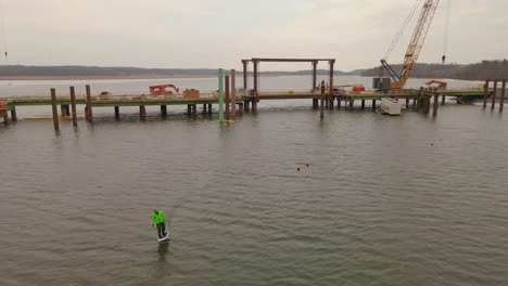 young man riding a hydrofoil board