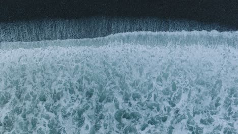 Aerial-Top-Down-Drone-Abstract-of-Shorebreak-on-Black-Rocks-El-Tunco-El-Salvador