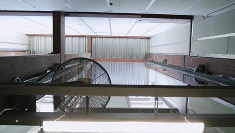 industrial fan and steel beams in a warehouse interior