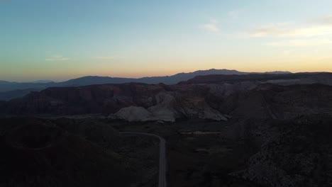 Sunset-over-rocks-and-mountains-in-Snow-Canyon-State-Park,-Utah