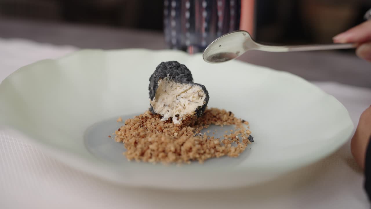 Eating Truffle Dessert With Crushed Nuts. - closeup shot