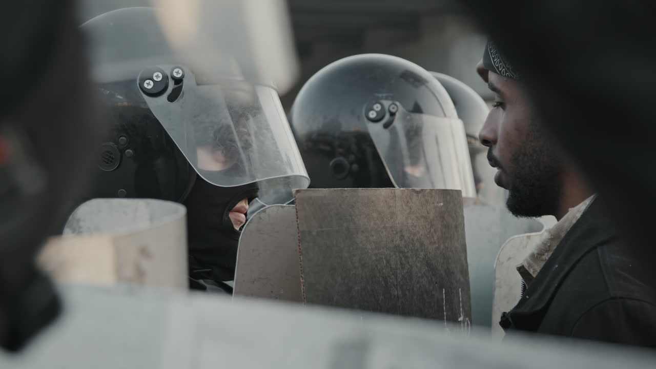 Riot Police Face Off with Protesters