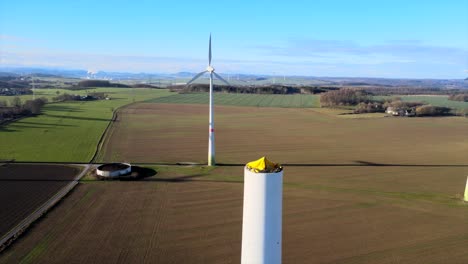 Building-the-Future-of-Clean-Energy:-New-Wind-Turbine-Under-Construction-on-a-Sunny-Field-in-Brilon,-Sauerland,-Germany