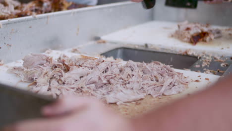 Tight-shot-of-chopping-pulled-pork-BBQ