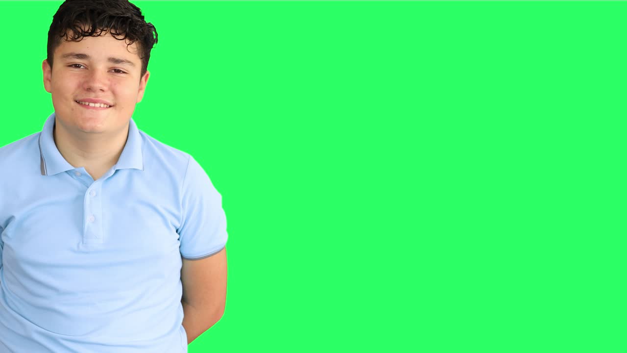 Portrait of a smiling teenage at green screen background 2