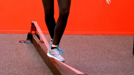 Woman-doing-balancing-exercise-in-fitness-studio-4k
