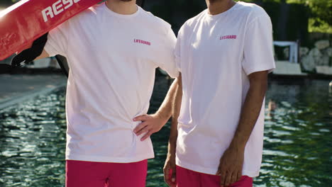 lifeguards smiling at the pool