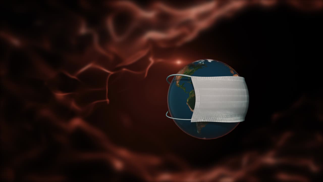 planeta en una máscara médica desechable flotando sobre un fondo de fuego.