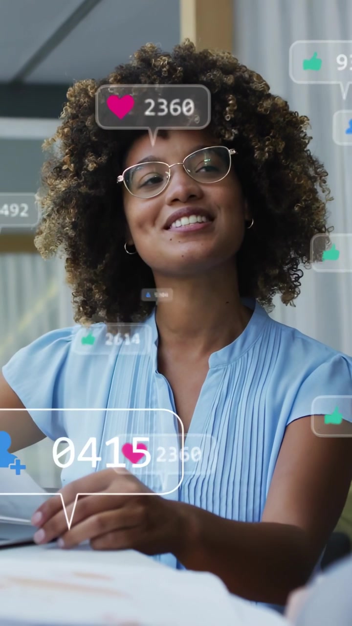 Vertical video: Woman reading pages, glancing and causing follower bubbles to update for marketing