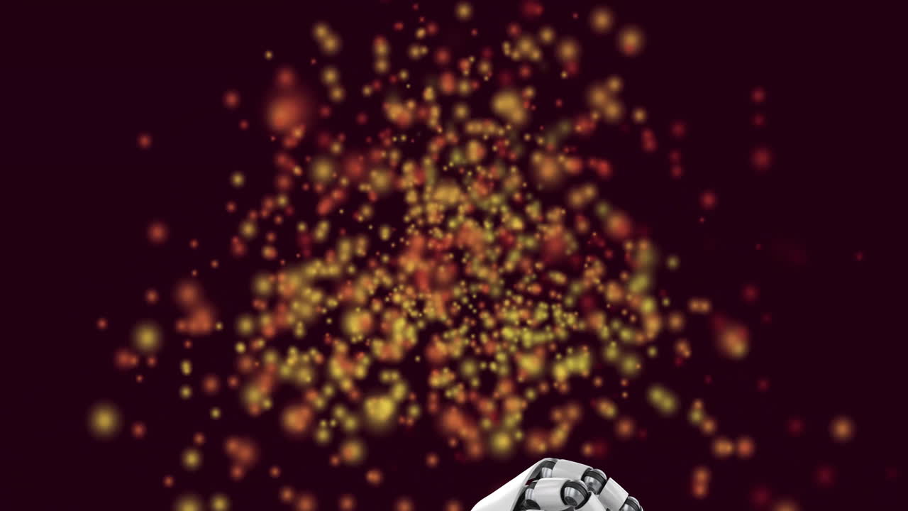 Animation showing glowing particles floating in warm colors against dark background