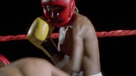 two boxers fighting in a boxing ring