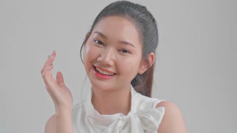beautiful woman cares for the skin face posing at studio