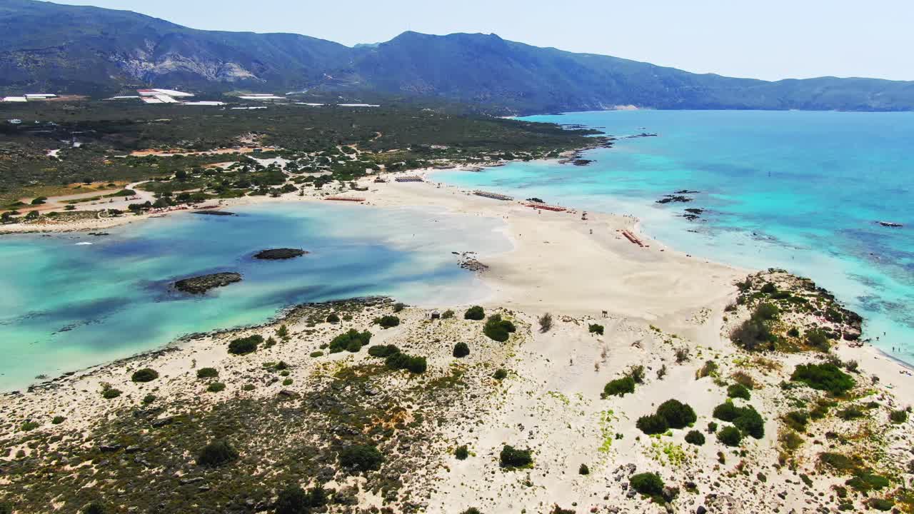 Aerial approach of turquoise water, Elafonissi Beach, Crete, Greece