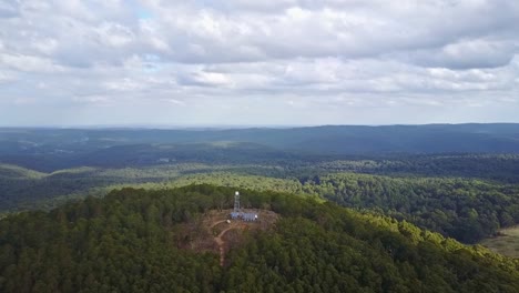 aerial footage flying over the fire tower on blue mountain, near newbury, central victoria, australia