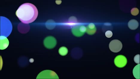Animation-of-multiple-colourful-spots-of-light-moving--in-seamless-loop-on-black-background-