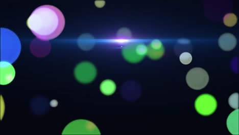 animation of multiple colourful spots of light moving  in seamless loop on black background