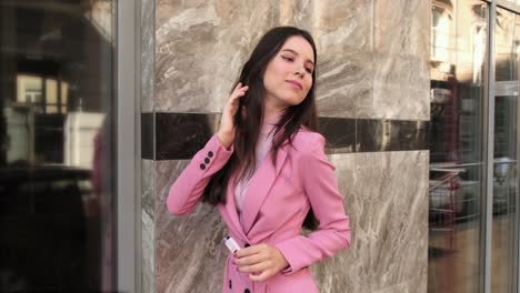 young-girl-on-the-street-listens-to-music-with-mp3-player