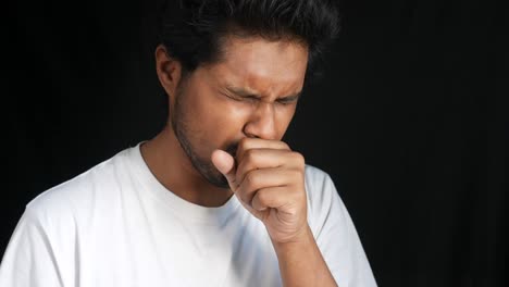 man coughing and feeling unwell