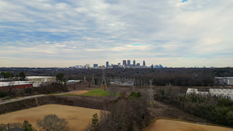 Power-station-and-electric-substation,-Downtown-Atlanta-famous-skyline-buildings-in-the-background,-GA,-USA