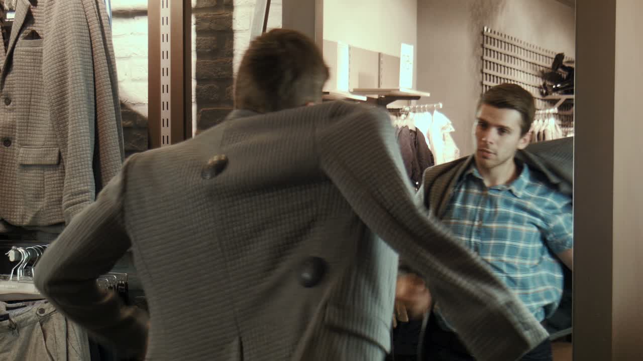 Man trying on clothes in a store
