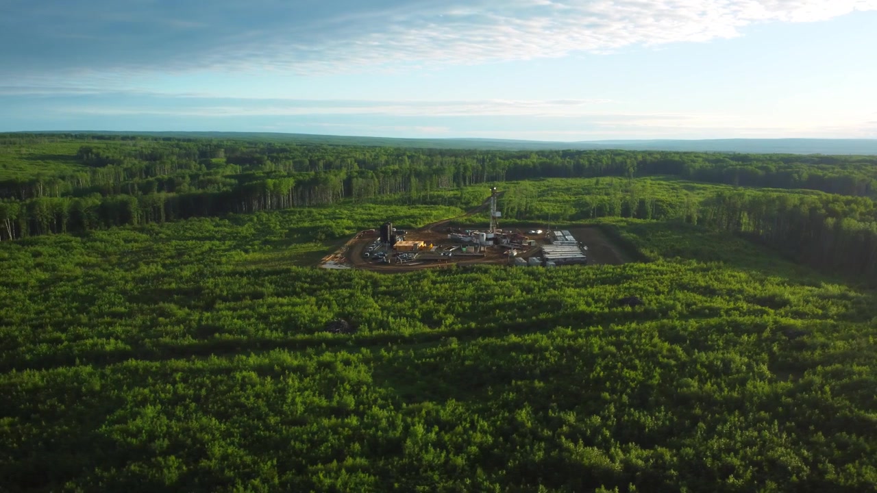 Golden Sunrise Over a Drilling Site in the Marten Hills Area, Alberta, Canada